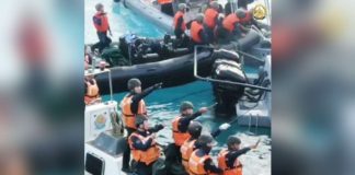China Coast Guard personnel brandish bolos against Philippine navy personnel during the June 17, 2024 resupply mission in a naval outpost in Ayungin (Second Thomas) Shoal. PHOTO FROM THE AFP