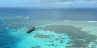 The BRP Sierra Madre, a Navy warship that now serves as a military outpost, keeps watch over Ayungin (Second Thomas), located within the country’s exclusive economic zone. Nearby are Chinese coast guard and militia vessels in this shot taken on February 21, 2023, during an aerial surveillance by the Philippine Coast Guard. PHILIPPINE DAILY INQUIRER, NIÑO JESUS ORBETA
