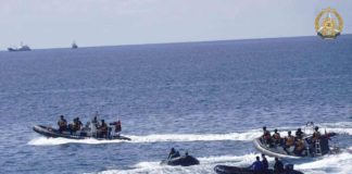 This handout photo taken on May 19, 2024 and received on June 4, 2024 from the Armed Forces of the Philippines shows two Chinese rigid-hulled inflatable boats (left and right) maneuvering close to Philippine personnel on board their boats (second from left and 2nd fron right) near the Philippine outpost at Second Second Thomas Shoal in disputed waters of the South China Sea. PHOTO BY HANDOUT / ARMED FORCES OF THE PHILIPPINES / AFP