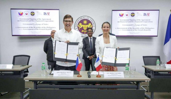 PH-France_resized Finance Secretary Ralph G. Recto (left) and Ambassador of the French Republic to the Philippines Marie Fontanel sign a government-to-government agreement on financial and development cooperation at the Department of Finance office in Manila on June 7, 2024. The agreement aims to deliver pioneering projects that help reduce poverty and pave the way to inclusive growth for all Filipinos. DEPARTMENT OF FINANCE PHOTO