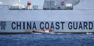This photo, taken on February 16, 2024, shows a rigid hull inflatable boat leaving a Chinese coast guard vessel near the China-controlled Scarborough Shoal in disputed waters of the South China Sea. On February 17, the Philippines accused Chinese coast guard vessels of “dangerous” maneuvers for attempting to block a Filipino vessel dropping supplies to fishermen at a reef off the Southeast Asian nation’s coast. PHOTO BY TED ALJIBE / AFP