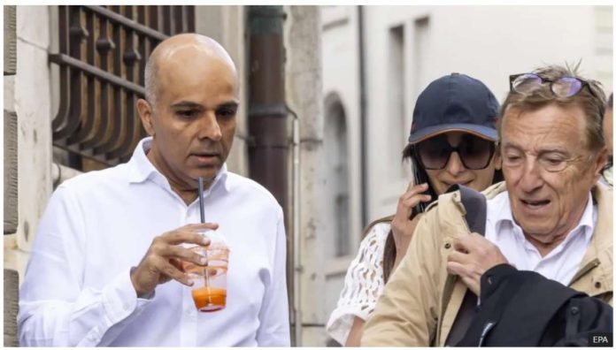 UK_resized Ajay Hinduja (left) and his wife Namrata arrive with their lawyer Robert Assael at a court house in Geneva. EPA