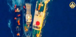 This frame grab from a handout video taken on June 17, 2024 and released by the Armed Forces of the Philippines Public Affairs Office shows an aerial view of a Philippine Rigid Hull Inflatable Boat (center) being sandwiched by two China coast guard vessels during an incident off Second Thomas Shoal in the South China Sea.