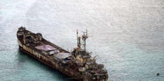 This aerial photograph taken from a military aircraft shows the dilapidated Sierra Madre ship of the Philippine Navy anchored near Ayungin shoal (Second Thomas Shoal) with Philippine soldiers on-board to secure the perimeter in the Spratly group of islands in the South China Sea, west of Palawan. AFP