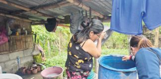 Personnel of the Iloilo Provincial Health Office help residents of Barangay Odiongan, Badiangan search and destroy mosquito breeding places. ILOILO PROVINCIAL HEALTH OFFICE PHOTO