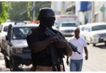 A police officer stands guard in Haiti’s capital Port-Au-Prince. REUTERS