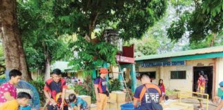 Personnel of the Binalbagan Fire Station bring water to La Castellana residents affected by the Kanlaon Volcano eruption. The displaced residents are currently taking shelter at the evacuation center in La Castellana National High School. BFP R6 BINALBAGAN FIRE STATION PHOTO