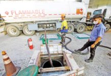 A gasoline station’s underground tank is refilled with gasoline from a fuel tanker, at the corner of Blumentritt Street and España Boulevard in Metro Manila. DANNY PATA/FILE PHOTO
