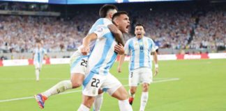 Lautaro Martinez (No. 22) and teammates celebrate after he fired a late goal to give Argentina all three points and book their spot in the next round of Copa America. DAILYMAIL PHOTO