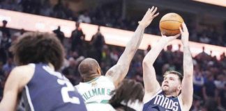 Dallas Mavericks’ Luka Doncic shoots over the defense of Boston Celtics’ Xavier Tillman Sr. AP