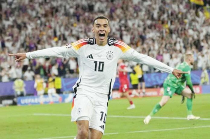 sports_Germany_resized Germany’s Jamal Musiala celebrates after scoring his side’s second goal during a round of 16 match between Germany and Denmark. AP PHOTO/ANDREEA ALEXANDRU