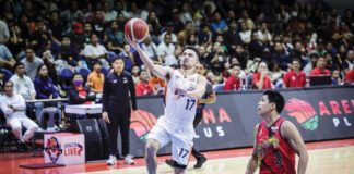 Ilonggo Anjo Caram of Meralco Bolts scoops for a layup as San Miguel Beermen’s Celedonio Trollano looks on. PBA PHOTO