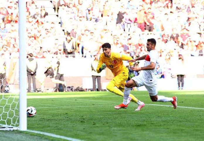 sports_Portugal_resized Turkey’s goalkeeper Altay Bayindir and Samet Akaydin try to reach the ball to prevent an own goal violation but were unsuccessful. GETTY IMAGES
