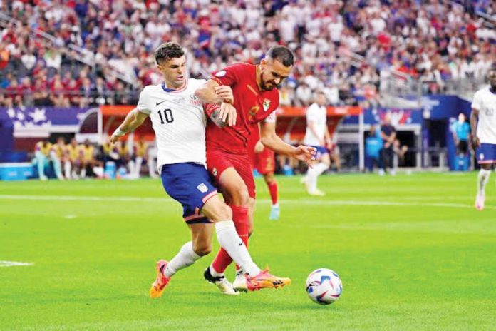 sports_Pulisic_resized Bolivia’s defender Luis Haquin (No. 4) and United States forward Christian Pulisic (No. 10) chase the ball during their Copa America game on Sunday. PHOTO COURTESY OF USA TODAY SPORTS