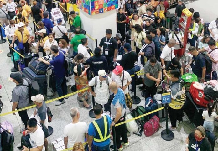 stranded-passenger A total of 2,951 passengers were stranded at the Bacolod-Silay Airport in Negros Occidental and Iloilo Airport in Iloilo Province on Tuesday morning, June 4, following the eruption of Kanlaon Volcano. Photo shows the stranded passengers at the Iloilo Airport in Cabatuan town. CAAP ILOILO PHOTO