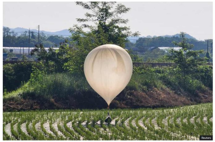 world-korea On May 29, a balloon believed to have been sent by North Korea carrying various objects including what appeared to be trash and excrement was spotted over a rice field at Cheorwon, South Korea. REUTERS