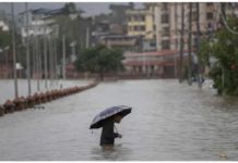 Massive South Asia floods affect millions A person wades through a flooded street caused by the swollen Bagmati River after torrential rains in Kathmandu, Nepal on July 6, 2024. Streets in the Nepalese capital Kathmandu were flooded over the weekend from overflowing rivers. EPA