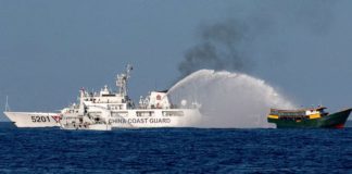 A Chinese Coast Guard vessel fires its water cannon at the Philippine resupply vessel Unaizah on May 4 on its way to a resupply mission at Ayungin (Second Thomas) Shoal in the West Philippine Sea. REUTERS