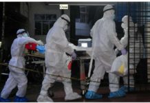 Indian boy dies from Nipah virus A patient with Nipah Virus is transferred in hospital. A group of people in personal protection gear are pushing the patient on a stretcher. Reuters