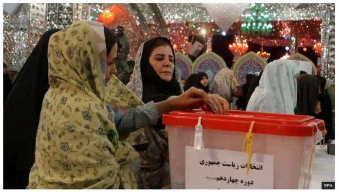 Iranian women cast their votes at a polling station in Tehran during the presidential election. Voters hope president-elect Masoud Pezeshkian will prioritize women’s rights. EPA