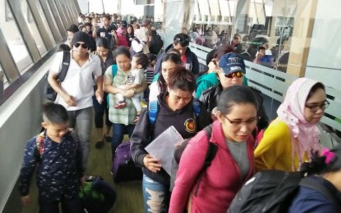 OFW_bank_accounts_resized Passengers, mostly overseas Filipino workers, arrive at the Ninoy Aquino International Airport. PNA FILE PHOTO BY CRISTINA ARAYATA