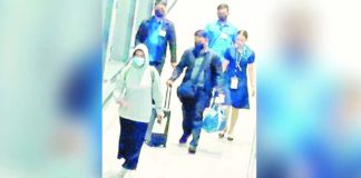 Germany-bound Vice President Sara Duterte-Carpio is seen walking at the Ninoy Aquino International Airport on Wednesday as the National Capital Region was being battered by Typhoon Carina.