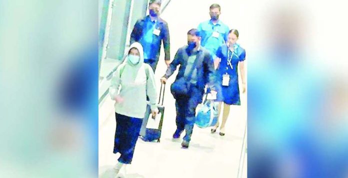 OVP_superimposed Germany-bound Vice President Sara Duterte-Carpio is seen walking at the Ninoy Aquino International Airport on Wednesday as the National Capital Region was being battered by Typhoon Carina.