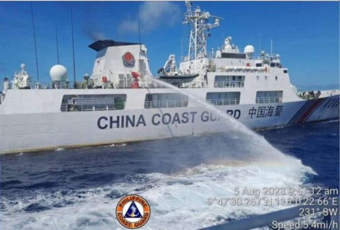 PCG_resized A China Coast Guard (CCG) ship is seen preparing to strike a Philippine Coast Guard (PCG) vessel with a water cannon as it is on its way to Ayungin (Second Thomas) Shoal. PCG FILE PHOTO