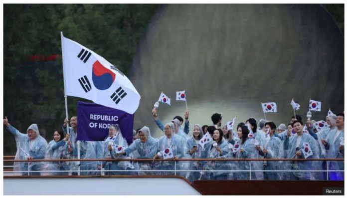 South_Korea_resized Athletes of South Korea aboard a boat in the floating parade on the river Seine during the opening ceremony of the 2024 Paris Olympics. REUTERS