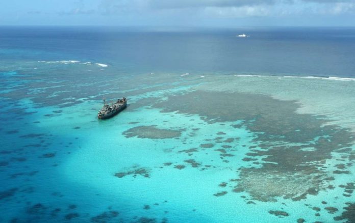 ayungin_resized The BRP Sierra Madre, a Navy warship that now serves as military outpost, keeps watch over Ayungin (Second Thomas), located within the country’s exclusive economic zone. Nearby are Chinese coast guard and militia vessels in this shot taken during an aerial surveillance by the Philippine Coast Guard. INQUIRER/ NIÑO JESUS ORBETA