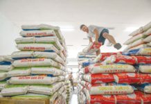Maximum SRP of imported rice to be lowered further to P49/kilo A worker arranges sacks of rice at a local rice store in Quezon City. MARIA TAN/ABS-CBN NEWS PHOTO