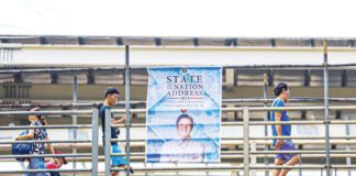 SONA-READY. A tarpaulin of President Ferdinand R. Marcos Jr. is seen on a footbridge in Commonwealth Avenue, Quezon City. The nation will listen to the third State of the Nation Address of the President today, July 22. PNA
