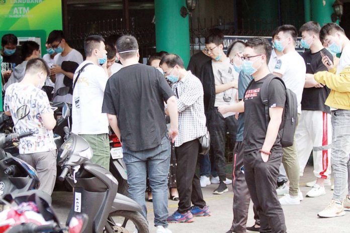 foreign_pogo_workers_resized The Bureau of Immigration said on Tuesday, July 23, it would revoke the visas granted to foreigners employed in Philippine Offshore Gaming Operator firms following the immediate ban on the online gambling companies. GMA NEWS FILE PHOTO