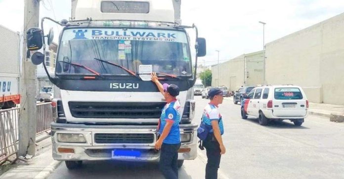 illegal_parking_resized The Land Transportation Office says crackdown on illegally parked vehicles involves ticketing and towing vehicles that are found parked illegally on the national highway. Photo shows a truck parked illegally beside the road in Iloilo City. JERRY TREÑAS/FACEBOOK PHOTO