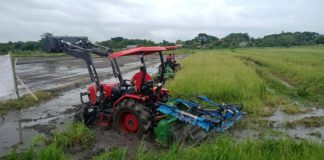 This is a field demonstration of a tractor, front loader, levee maker and rotating disc plow at the Western Visayas Agricultural Research Center in Jaro, Iloilo City.