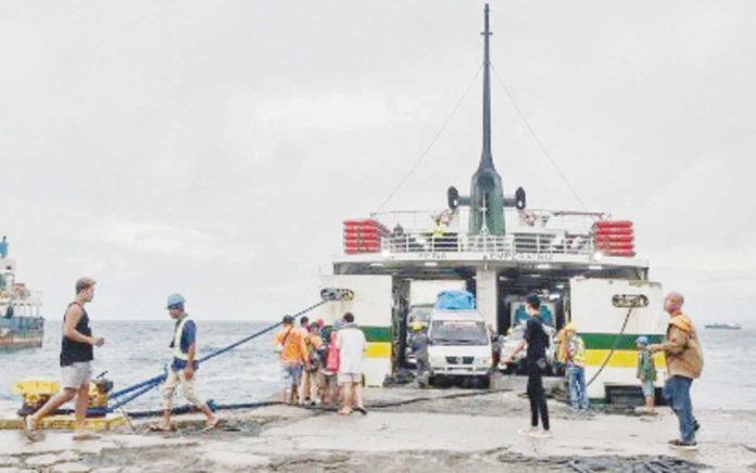 logistics_resized Maritime transportation is costlier in the Philippines than in neighboring countries in Southeast Asia, with destination charges playing a larger role. Photo shows passengers and cargoes loading a ferry in the port of Allen, Northern Samar. PHOTO COURTESY OF ARIES MATALAM