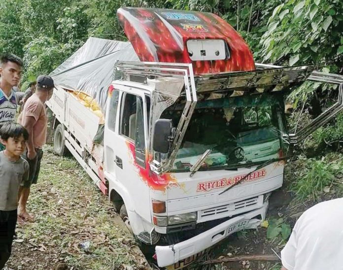road-mishap Driver Roel Memis died when he lost control of his truck and fell into a drainage canal while he was negotiating a descending section of the road in Barangay Cabagnaan, La Castellana, Negros Occidental on July 23. PHOTO COURTESY OF BRIGADA NEWS FM 103.1 BACOLOD