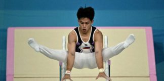 The Philippines’ Carlos Edriel Yulo competes in the parallel bars event of the artistic gymnastics men’s qualification during the Paris Olympics 2024 at the Bercy Arena in Paris, on July 27, 2024. Photo by Lionel BONAVENTURE / AFP