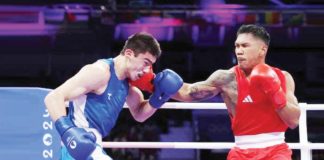 Filipino boxer Eumir Marcial unloads a right hook to the face of Turabek Khabibullaev of Uzbekistan. PHOTO COURTESY OF MAYE-E WONG