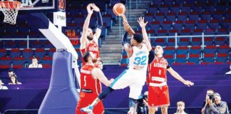 Gilas Pilipinas’ Justin Brownlee is undaunted by the tight defense of Georgia and goes for a shot in the FIBA Olympic Qualifying Tournament in Riga, Latvia last night. FIBA PHOTO