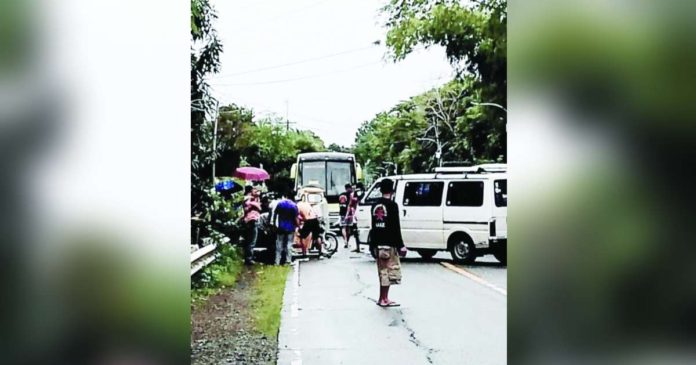 tricycle-van collision_superimposed Armando Jurilla and his two passengers were brought to Culasi District Hospital after his tricycle was hit by a van in in Barangay Lapaz, Tibiao, Antique on July 23. PHOTO COURTESY OF K5 NEWS FM SAN JOSE