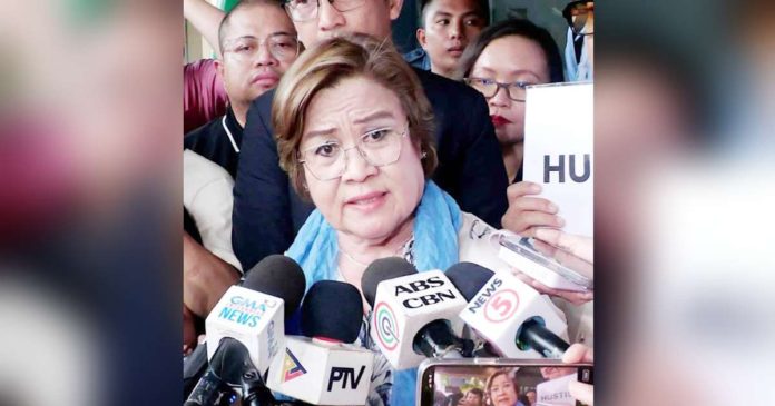 De Lima 1_superimposed Former senator Leila de Lima answers questions from the media in an ambush interview after the Muntinlupa Regional Trial Court on June 24, 2024 acquitted her in the last drug-related case filed by the Duterte administration. INQUIRER.NET FILE PHOTO/RYAN LEAGOGO