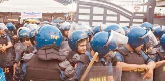 Police officers assemble outside the Kingdom of Jesus Christ compound in Davao City in this photo taken on August 24, 2024. Their objective is to serve an arrest warrant on fugitive televangelist Apollo Quiboloy. PHOTOS BY GERMELINA LACORTE