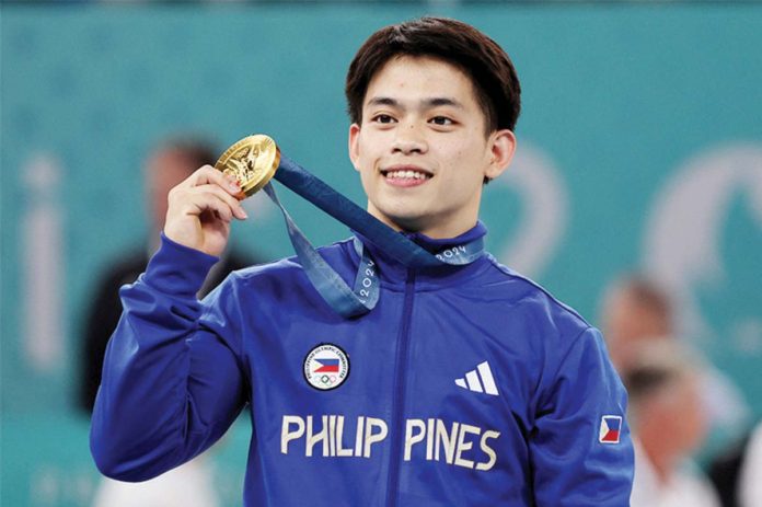 SPORTS_CALOY2_resized In Paris, Filipino gymnast Carlos Edriel Yulo (center) makes history as the Philippines’ first ever male athlete to win an Olympic gold medal. He is the second Filipino to win gold in the history of the Summer Games, the first being weightlifter Hidilyn Diaz in the Tokyo Olympics three years ago. AFP