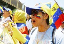 Women protests during a march in Venezuela. Demonstrations have been held across the country and in cities around the world over questionable election results. REUTERS