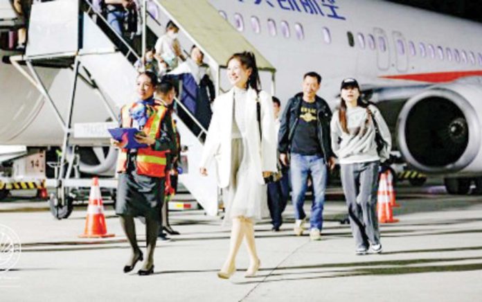 chinese_tourists_resized Chinese tourists alight from the plane upon arrival in Kalibo, Aklan in this photo taken in April 2023. PHOTO COURTESY OF DOT