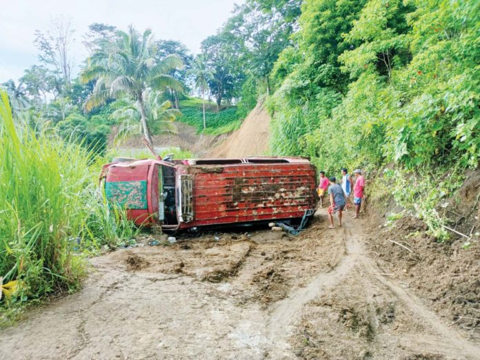 front_pic1_resized Two children aged five and 13 died and 16 other passengers were injured after a jeepney skidded on a slippery curve and overturned in Barangay Cagay, Leon, Iloilo on Tuesday morning, August 13. AJ PALCULLO/PN