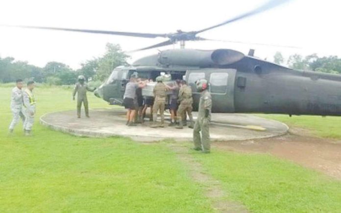 The Tactical Operations Group 6 of the Philippine Air Force airlifts the bodies of high-ranking leaders of the New People’s Army - Panay, including Vicente Hinojales, the Regional Secretary of Komiteng Rehiyon-Panay, from Barangay Cabatangan, Lambunao, Iloilo to the town proper on Aug. 19, 2024. Hinojales was buried at the Lambunao Eco Park in Barangay Sibacungan on Aug. 22. PHOTO COURTESY OF 3 DPAO