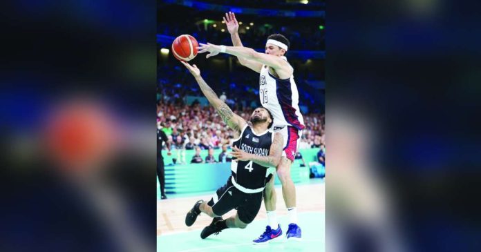 sports Team USA_superimposed Team USA’s Devin Booker blocks the shot of South Sudan’s Carlik Jones. PHOTO FROM PHOENIX SUNS’ FACEBOOK PAGE