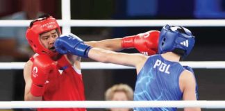 Filipina Nesthy Petecio trades punches with Poland’s Julia Szeremeta. REUTERS